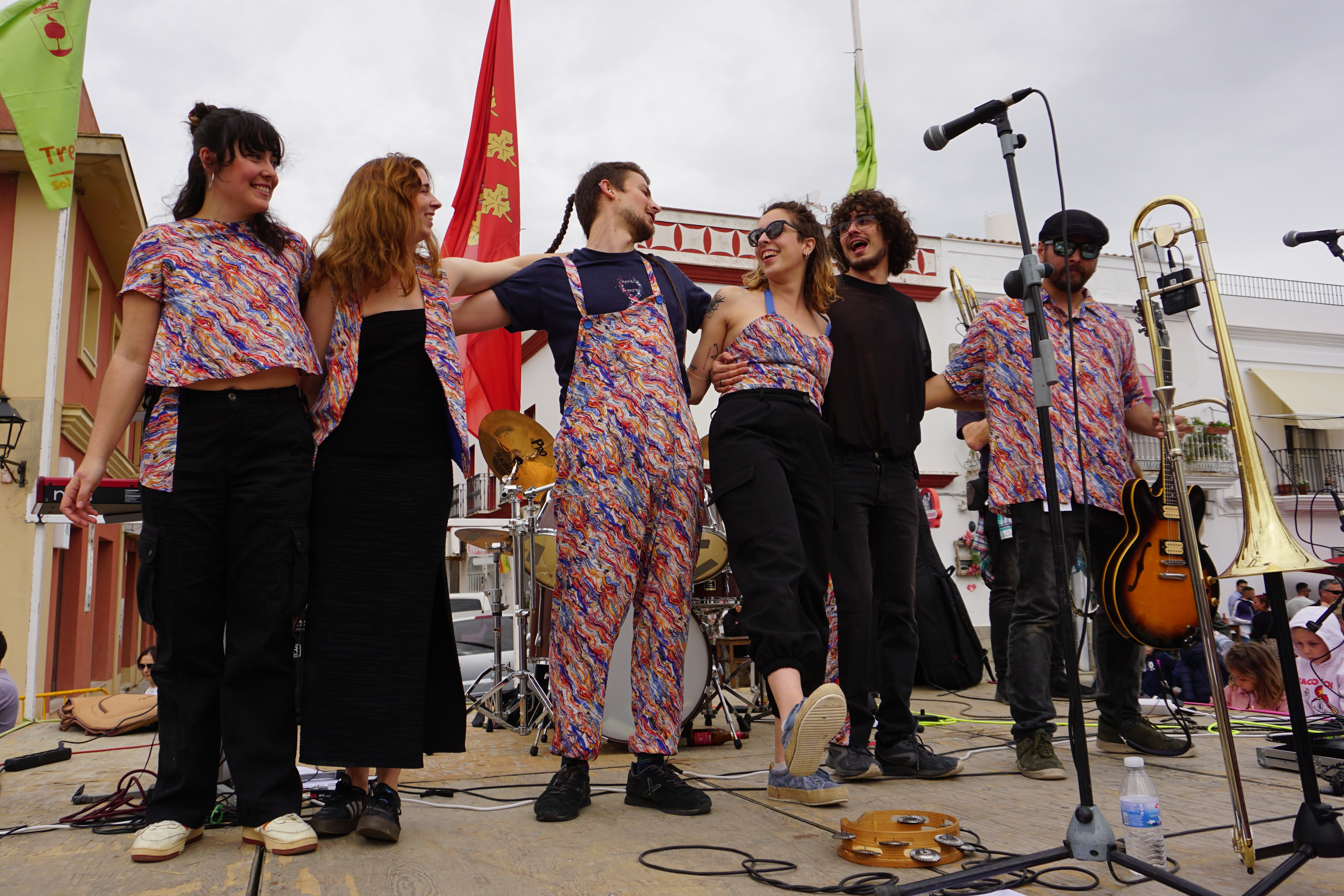 The band bows on stage